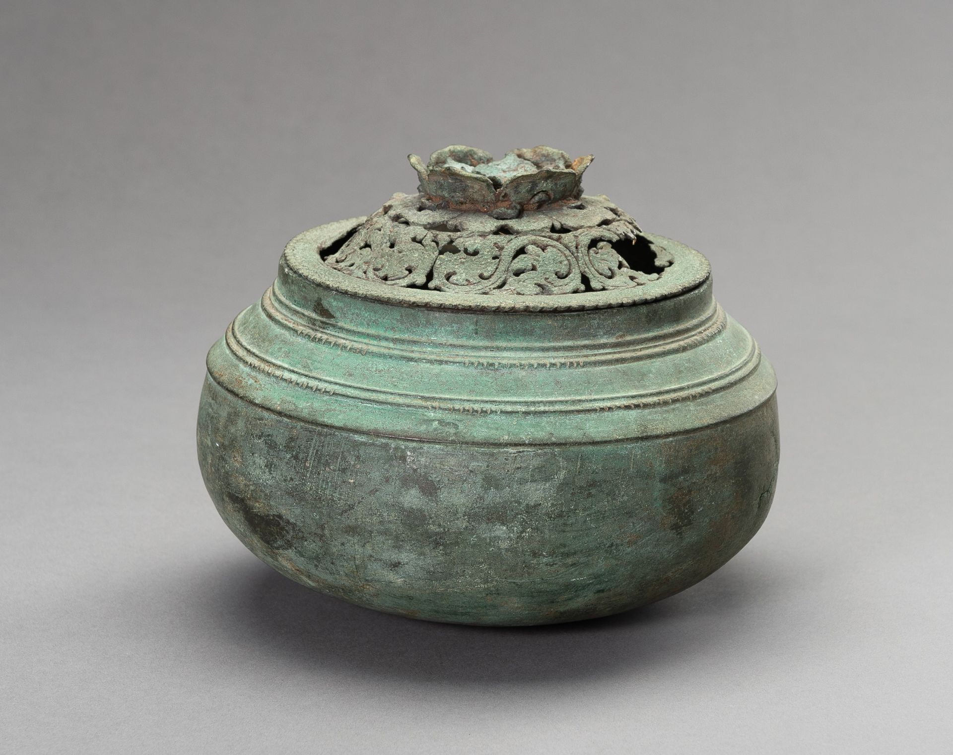 A JAVANESE BRONZE INCENSE BURNER AND COVER