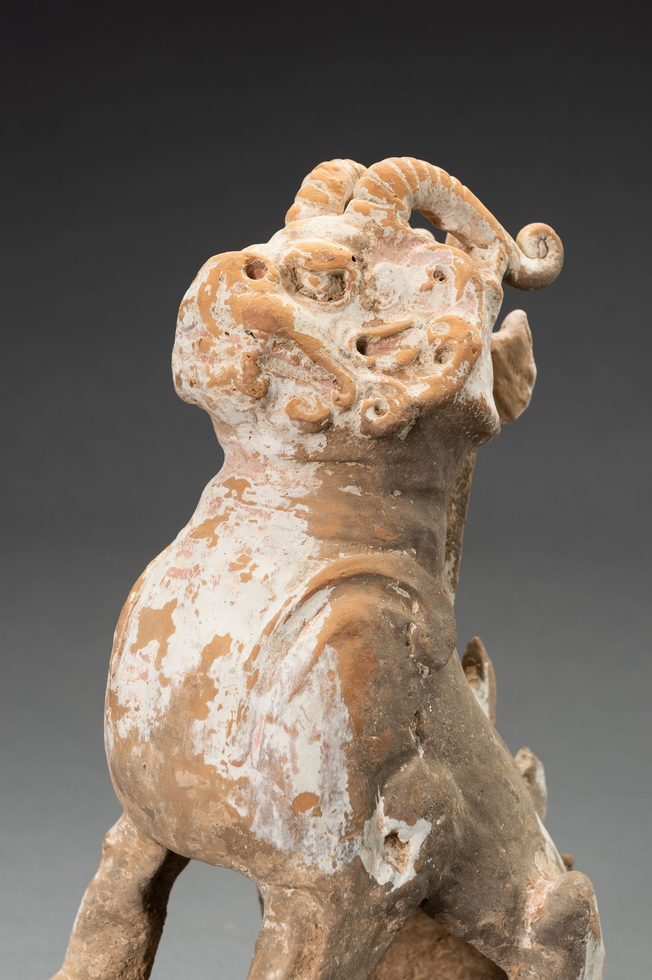 A POTTERY FIGURE OF A HORNED GUARDIAN BEAST, TANG DYNASTY OR EARLIER - Image 2 of 13