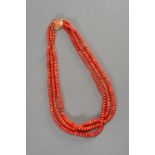 A THREE-TIERED MOMO CORAL BEAD NECKLACE