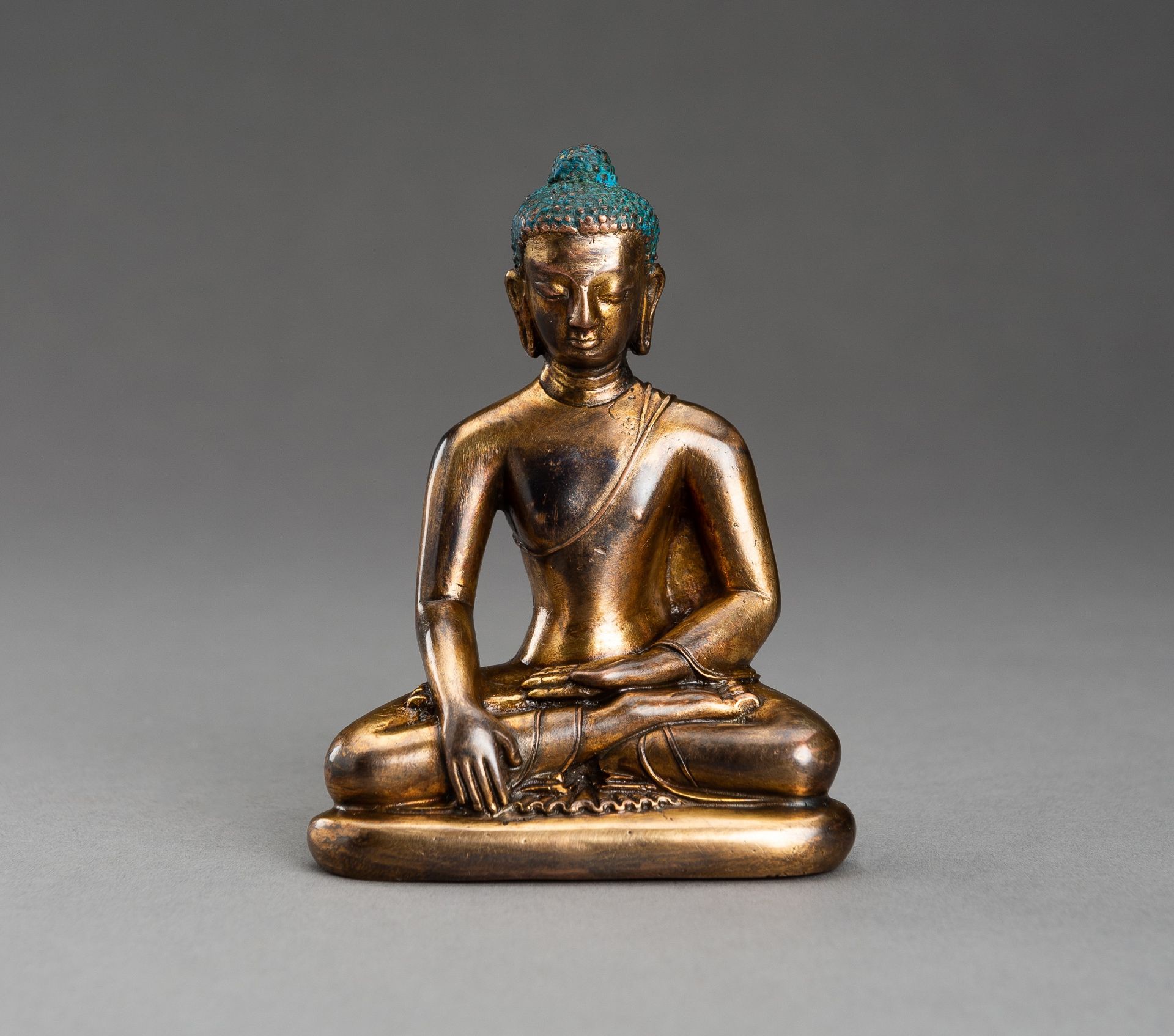 A NEPALI COPPER-BRONZE FIGURE OF BUDDHA