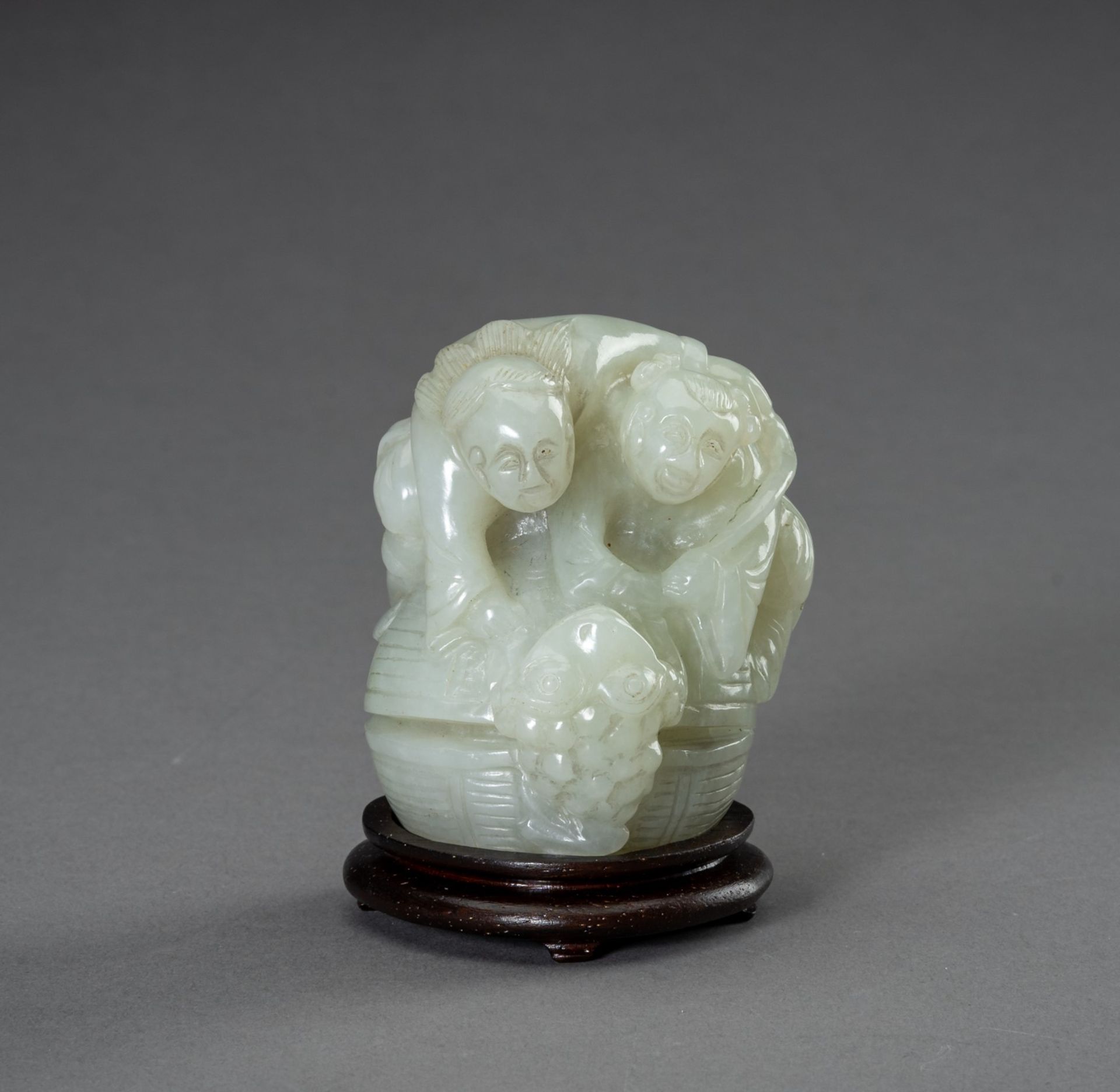 A PALE CELADON JADE GROUP, 20th CENTURY