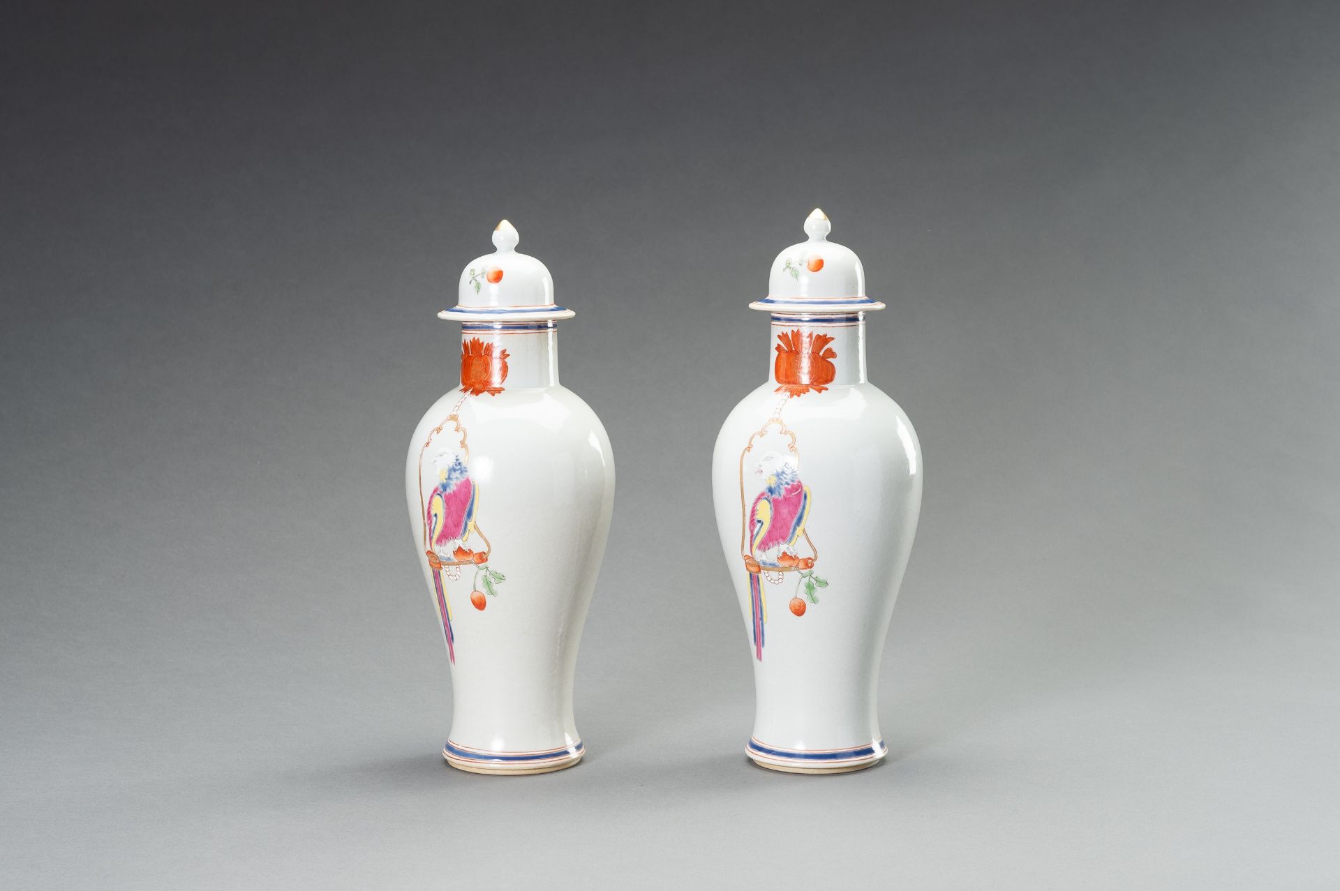 A PAIR OF FAMILLE ROSE 'PARROT ON PERCH' BALUSTER VASES, QING - Bild 7 aus 12
