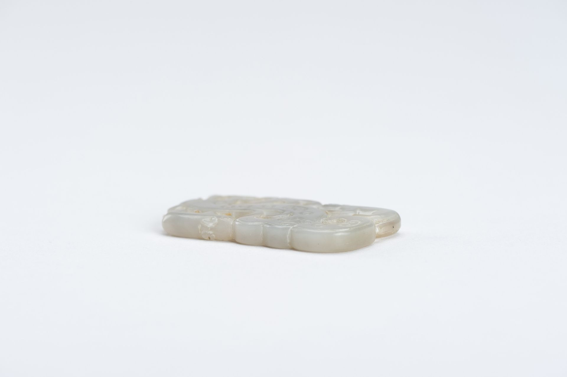 A CELADON-WHITE JADE 'DRAGON AND TAPIR' PENDANT, QING DYNASTY - Image 7 of 7