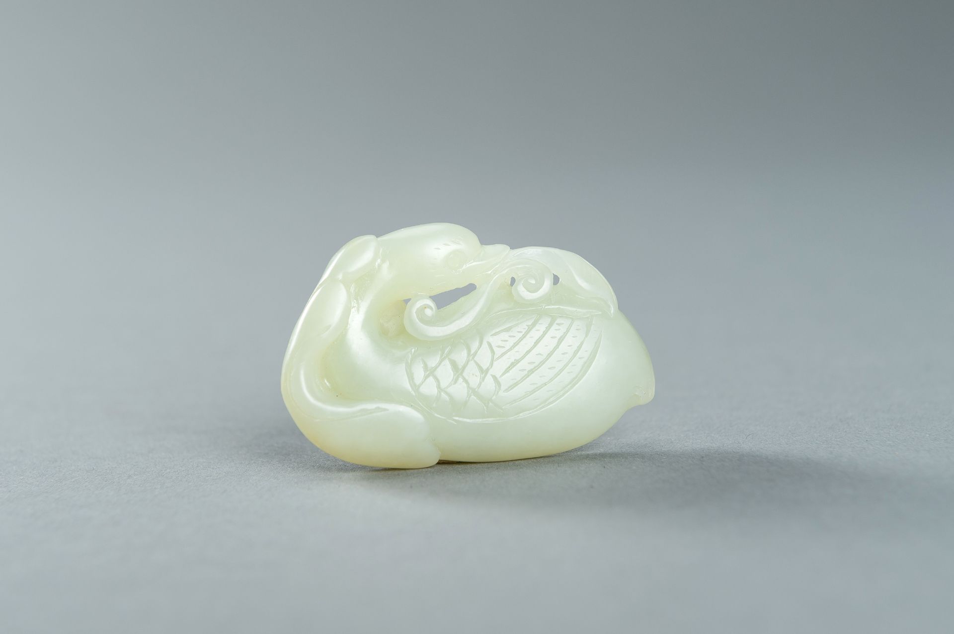 A PALE CELADON JADE CARVING OF A DUCK, 1900s - Image 2 of 13