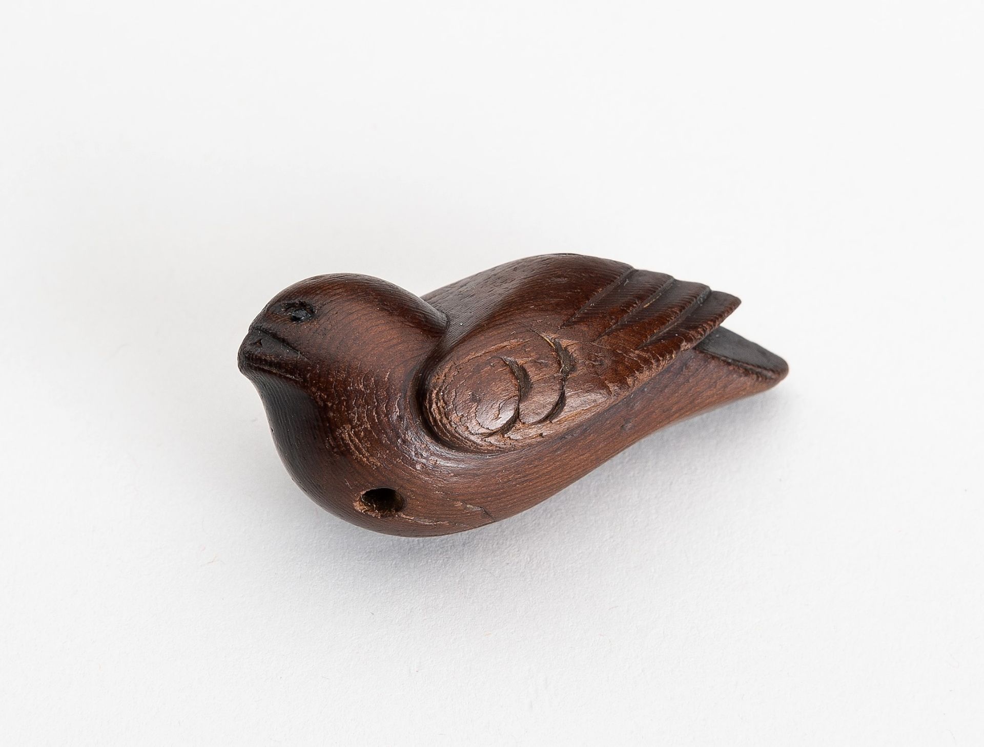 A WOOD NETSUKE OF A SPARROW, EDO