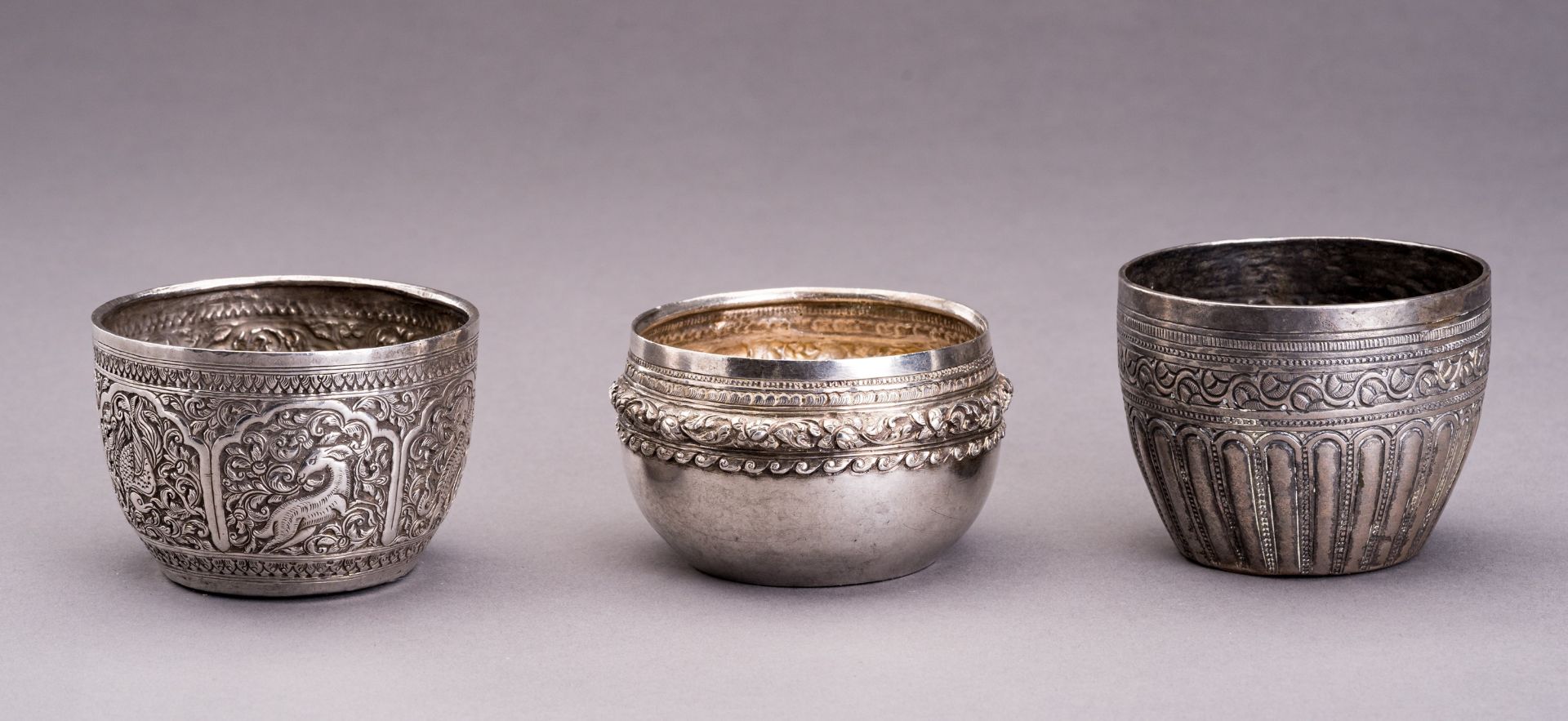 A LOT WITH THREE EMBOSSED SILVER BOWLS