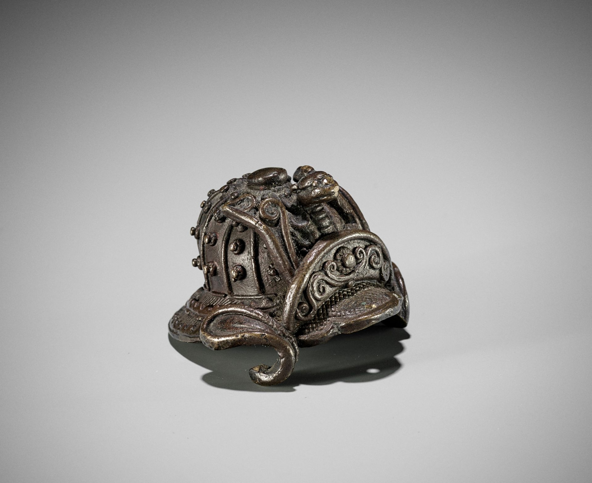 A MINIATURE BRONZE MODEL OF A KABUTO