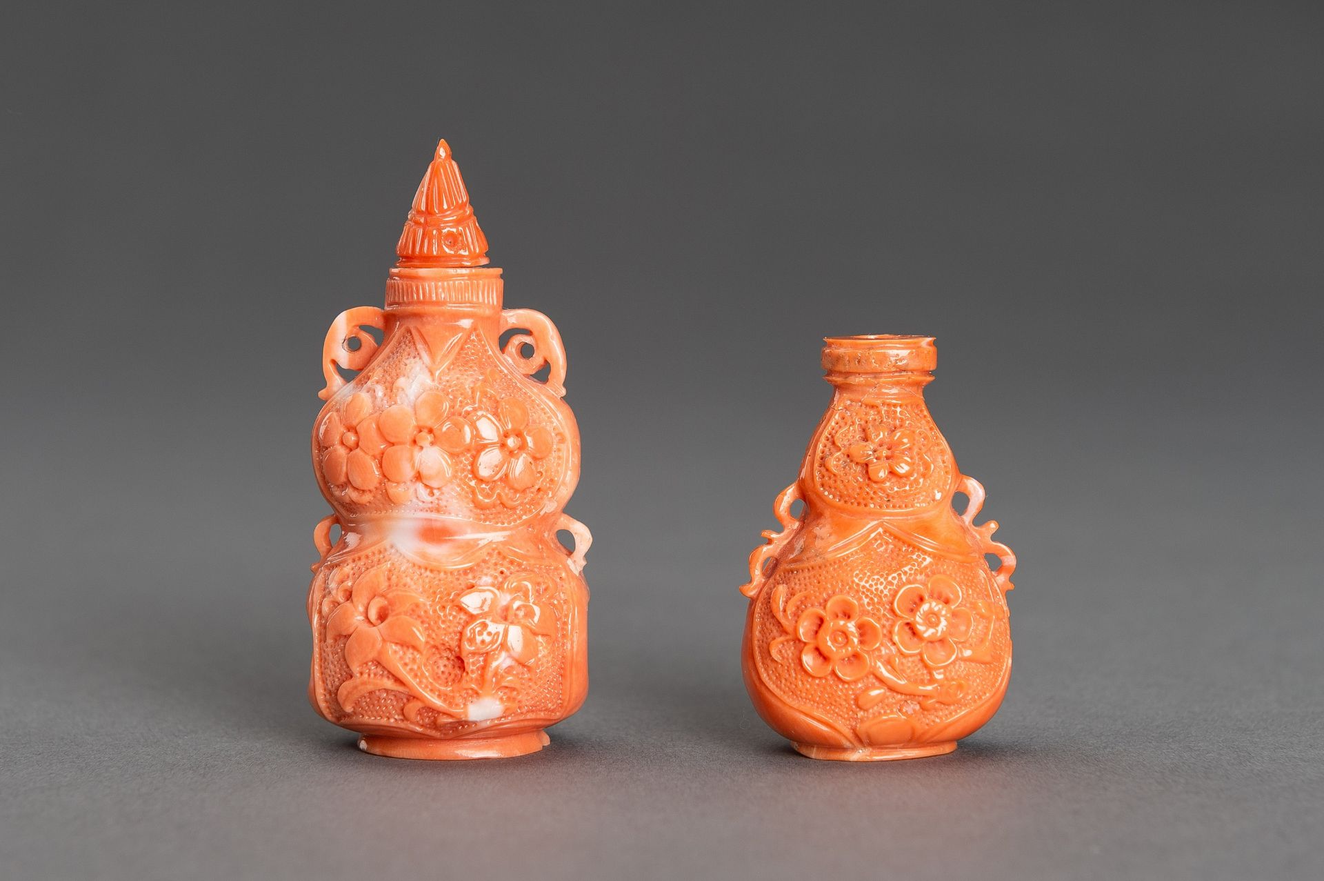 TWO CARVED MOMO CORAL SNUFF BOTTLES, c. 1920s