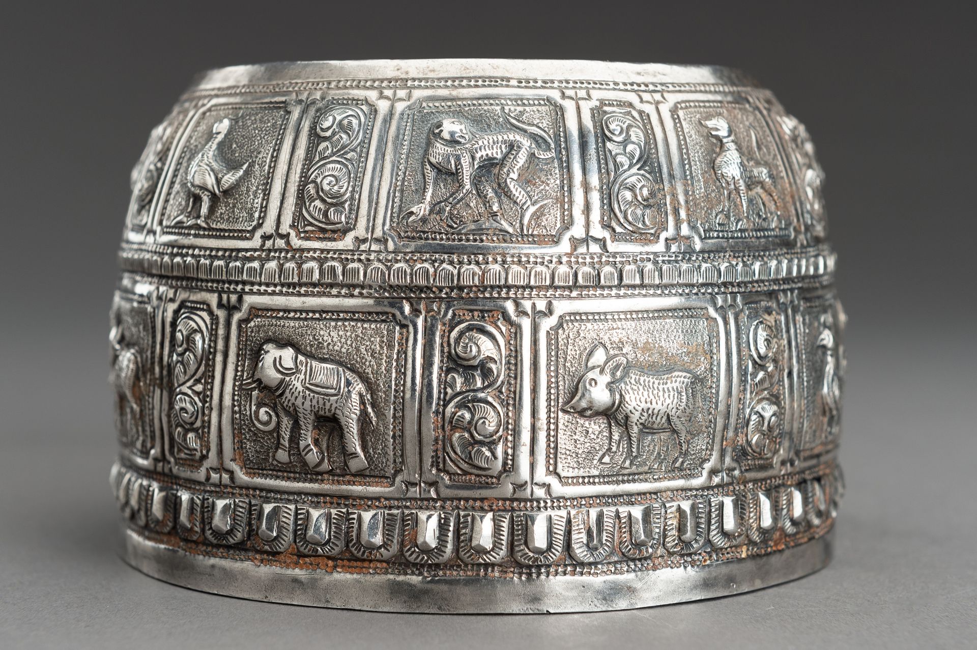 AN EMBOSSED SILVER BOWL WITH ANIMAL RELIEF