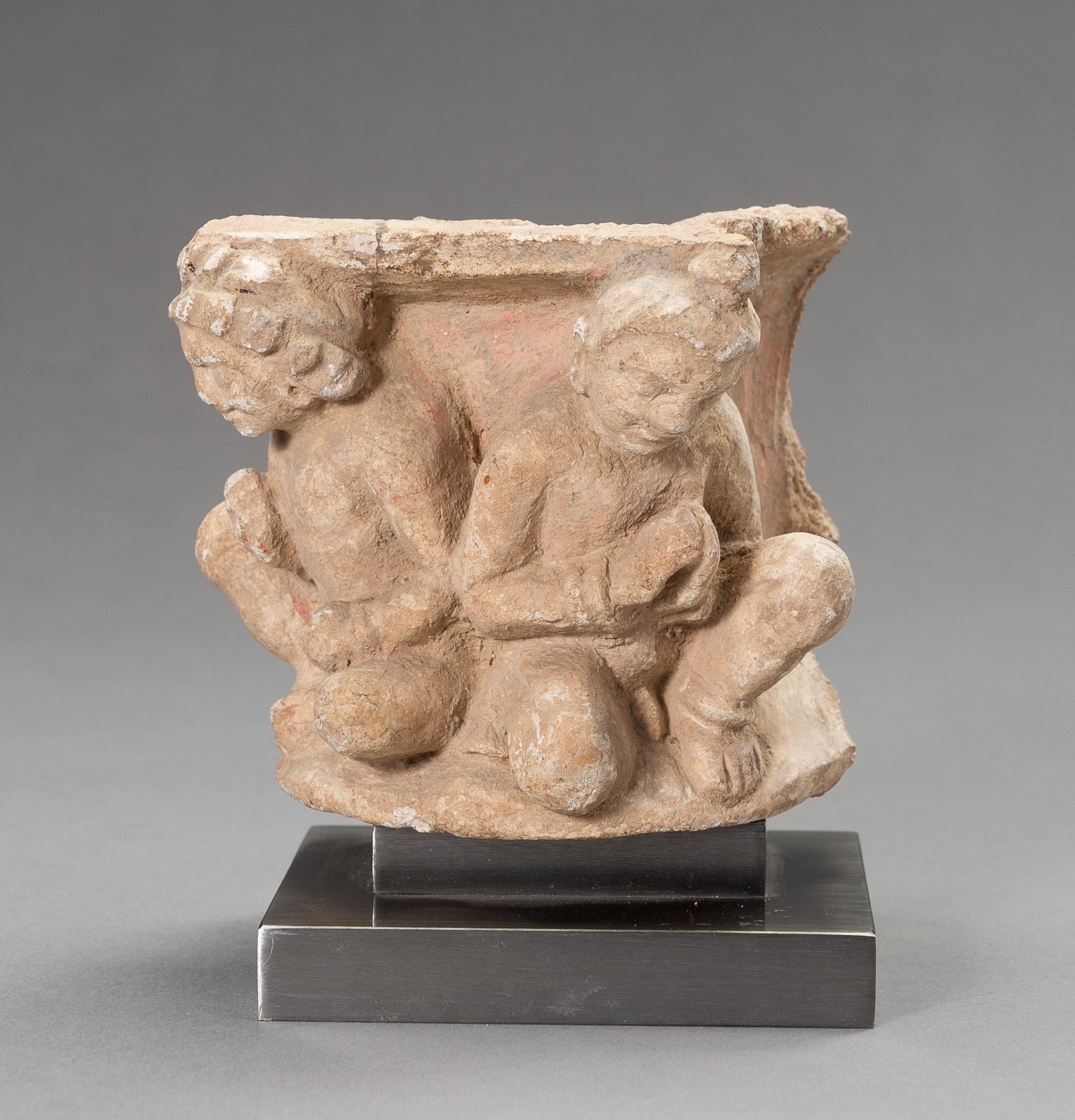 A GANDHARA STUCCO FRAGMENT WITH ADORANTS