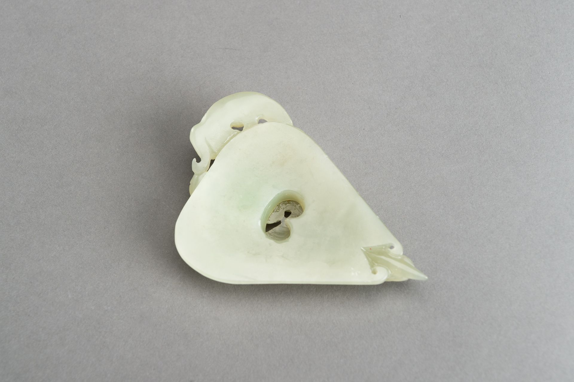 AN ARCHAISTIC PALE CELADON JADE PENDANT OF A CHILONG, 1920s - Image 3 of 14