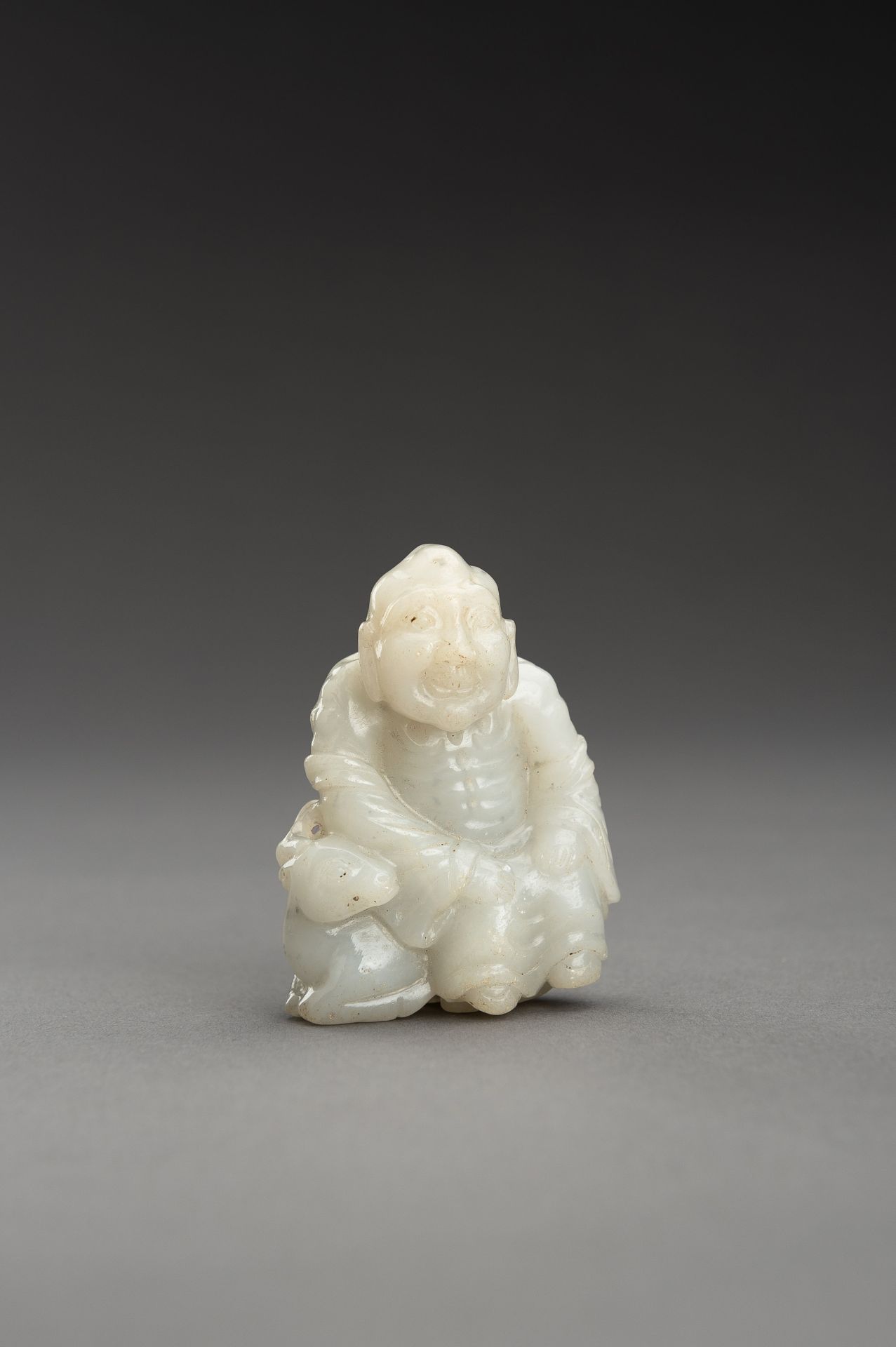 A WHITE JADE GROUP OF A LUOHAN AND DEER - Image 2 of 10