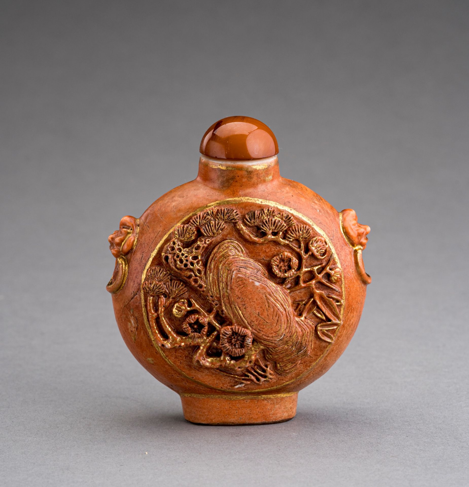 WANG JIEMAI: A LARGE PORCELAIN SNUFF BOTTLE WITH HIGH RELIEF DECORATION