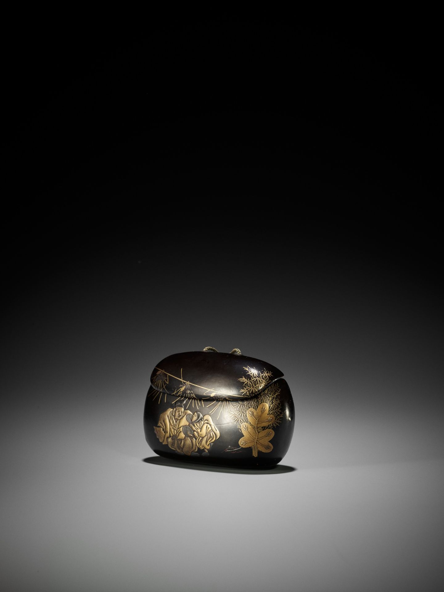 A RARE BLACK AND GOLD LACQUER TONKOTSU DEPICTING A NEW YEAR'S SCENE - Image 4 of 7