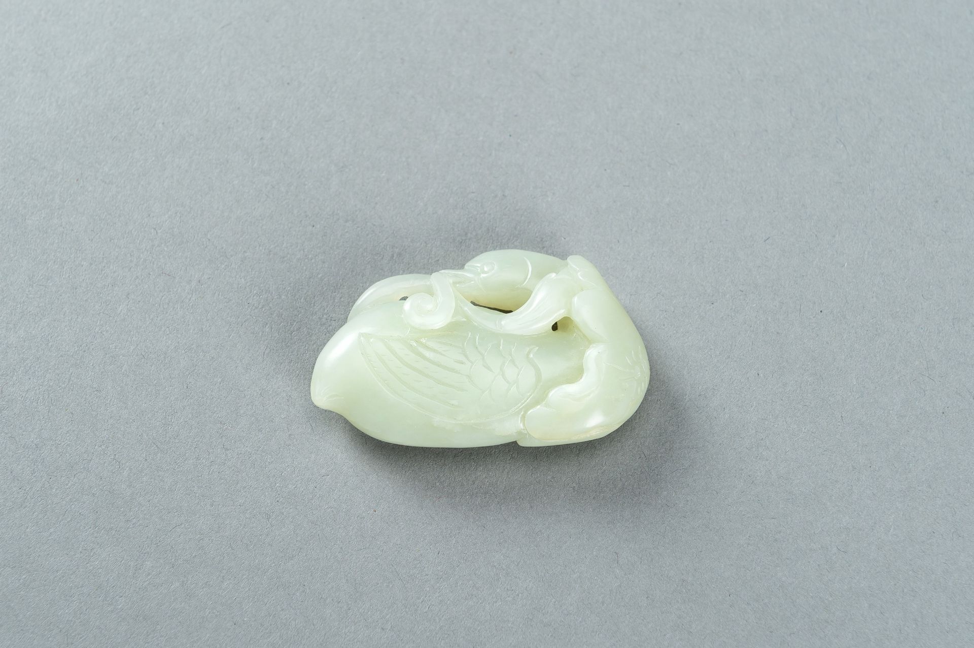 A PALE CELADON JADE CARVING OF A DUCK, 1900s - Image 7 of 13