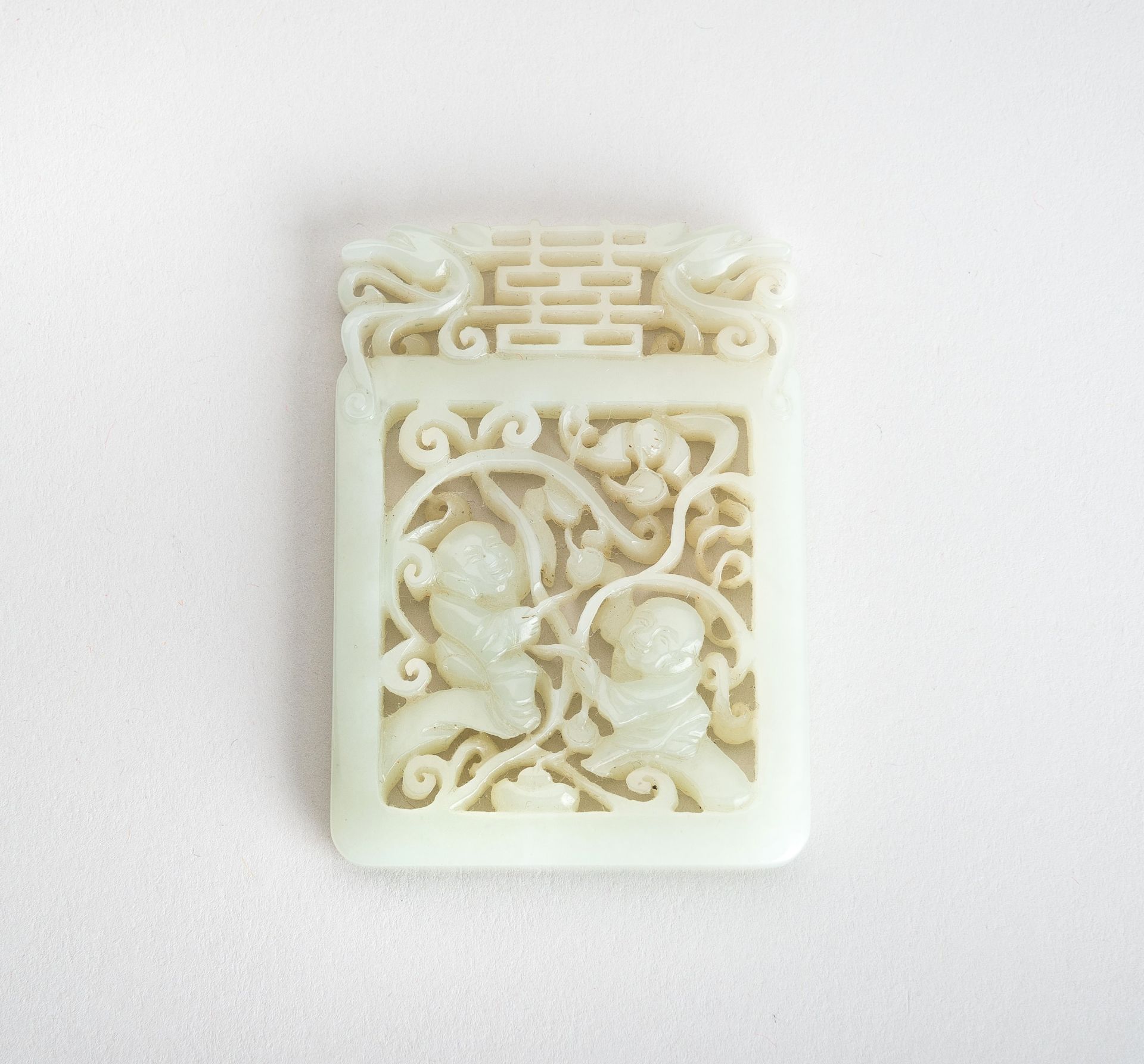 A PALE CELADON JADE PLAQUE WITH 'BOYS AT PLAY', 1900s