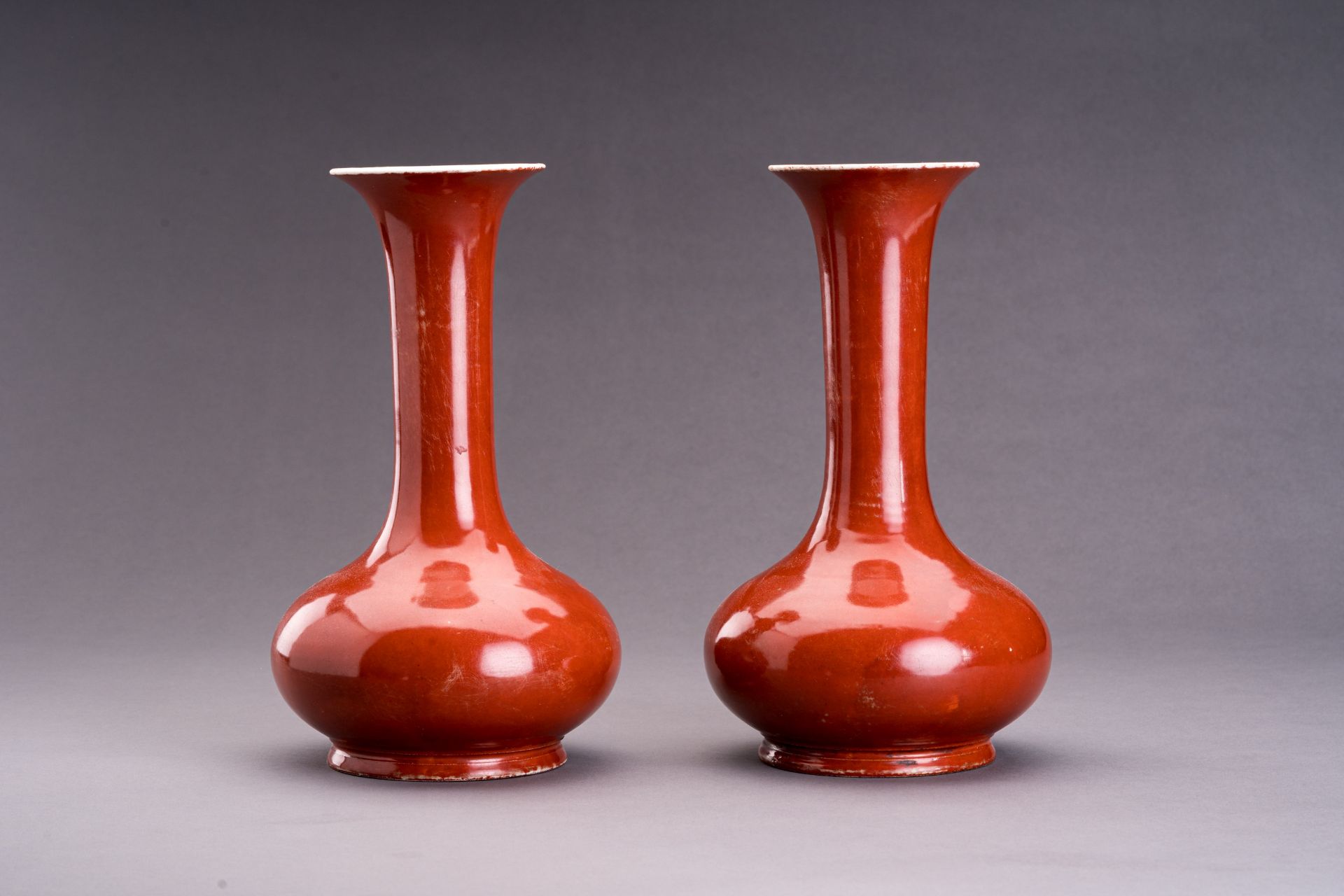 A PAIR OF A COPPER-RED PORCELAIN BOTTLE VASES - Image 2 of 6