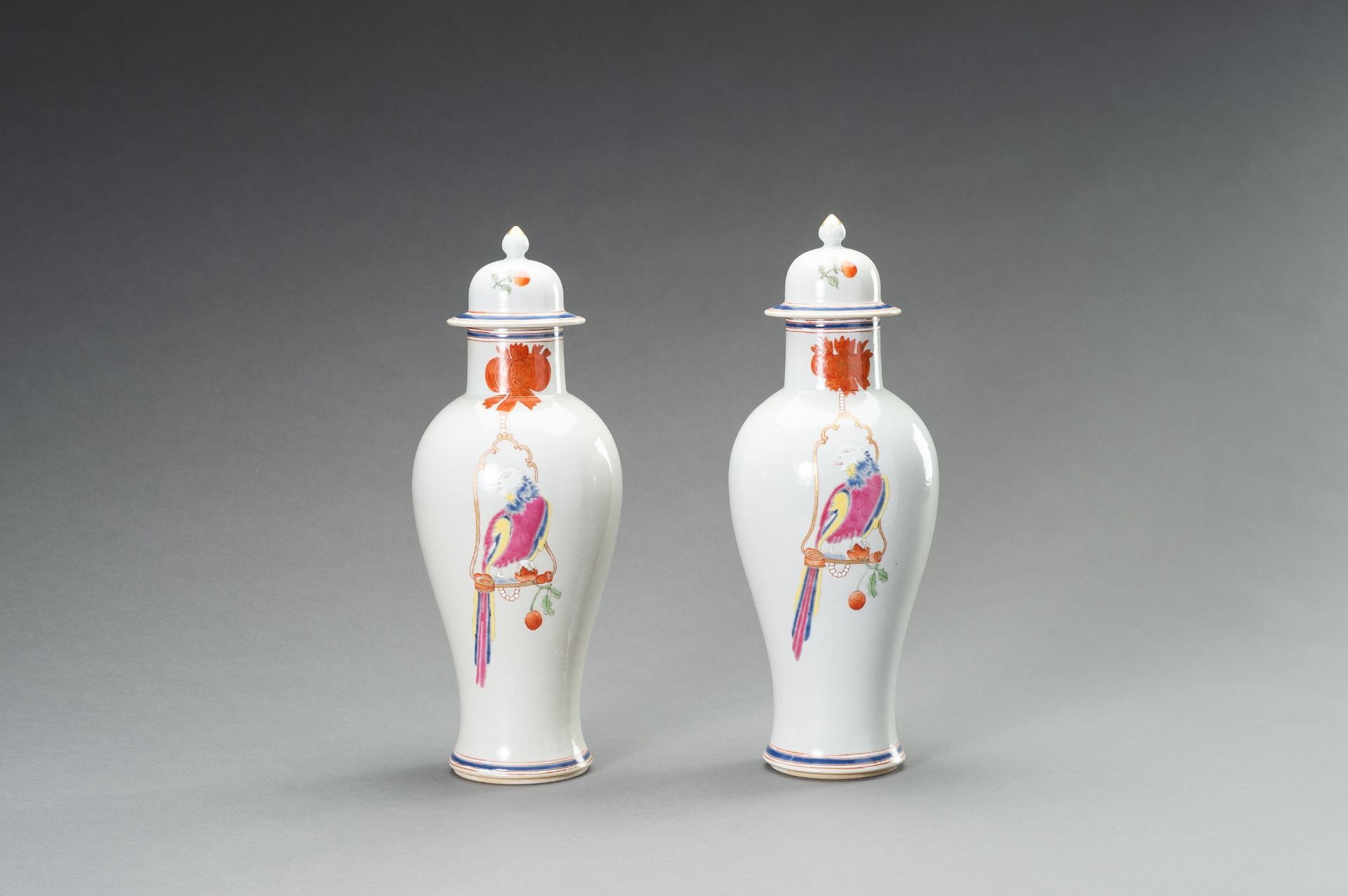 A PAIR OF FAMILLE ROSE 'PARROT ON PERCH' BALUSTER VASES, QING - Bild 2 aus 12