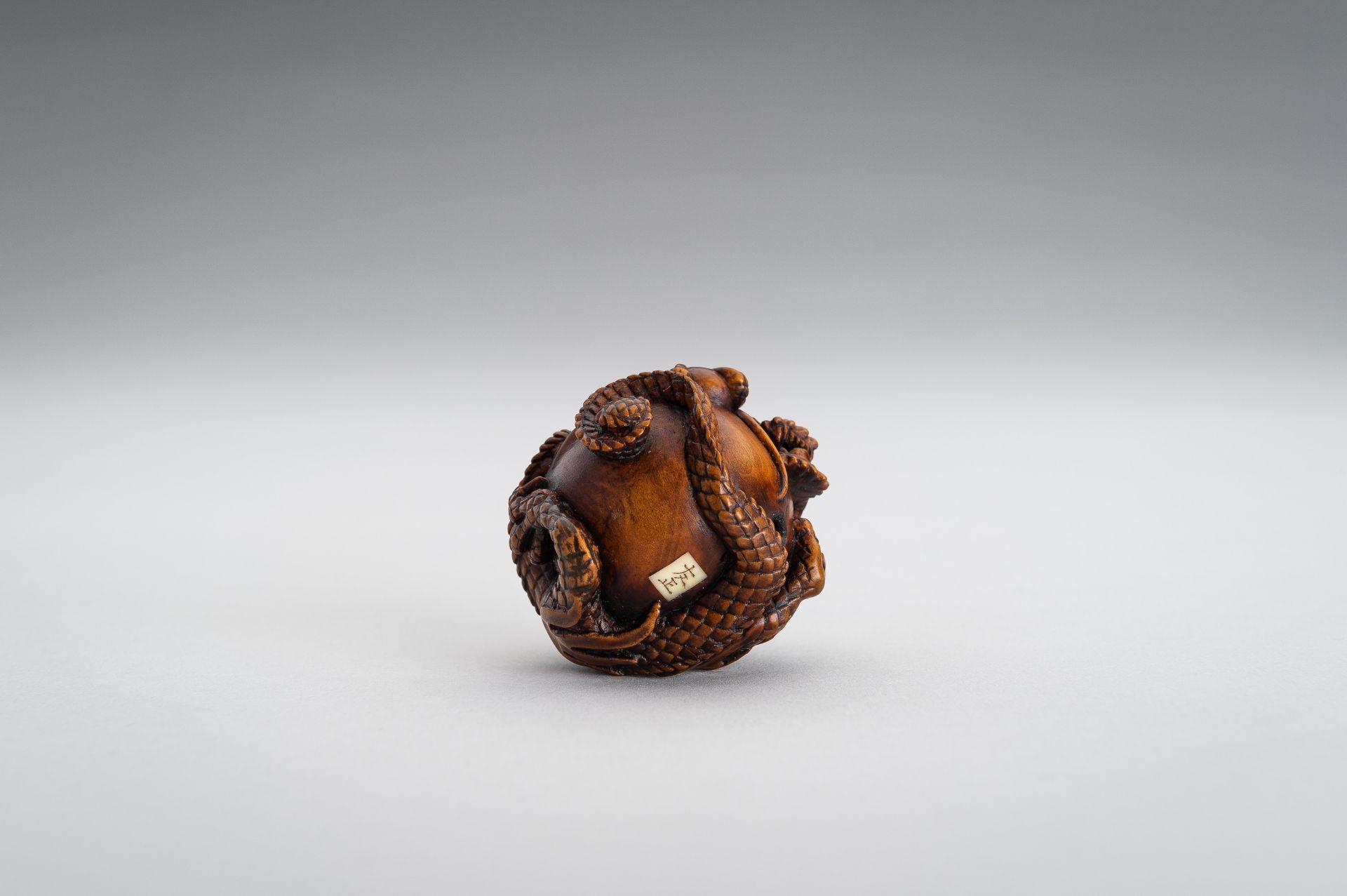 TOMOMASA: A BOXWOOD NETSUKE OF A COILED DRAGON - Image 12 of 15