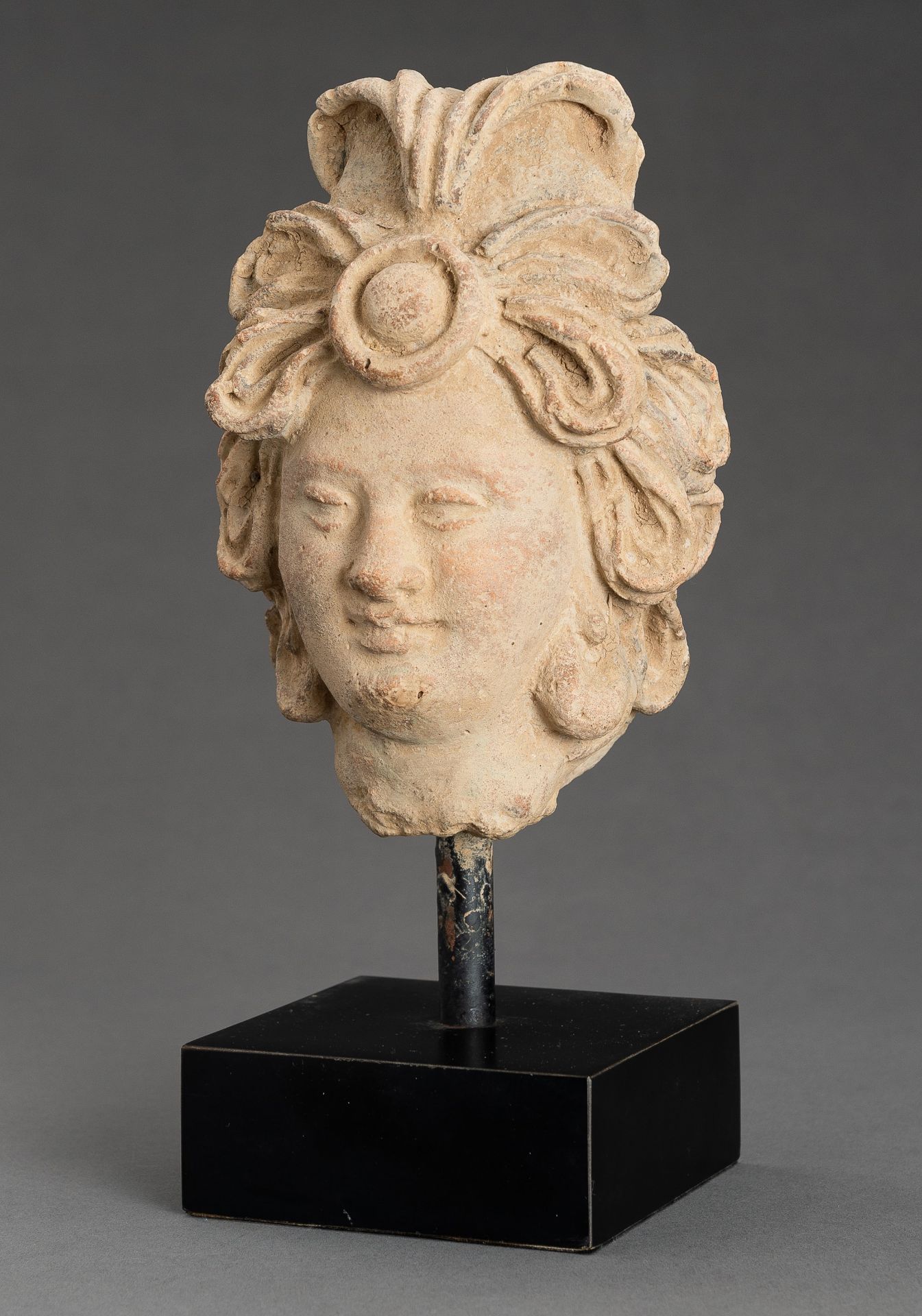 A STUCCO HEAD OF A BODHISATTVA