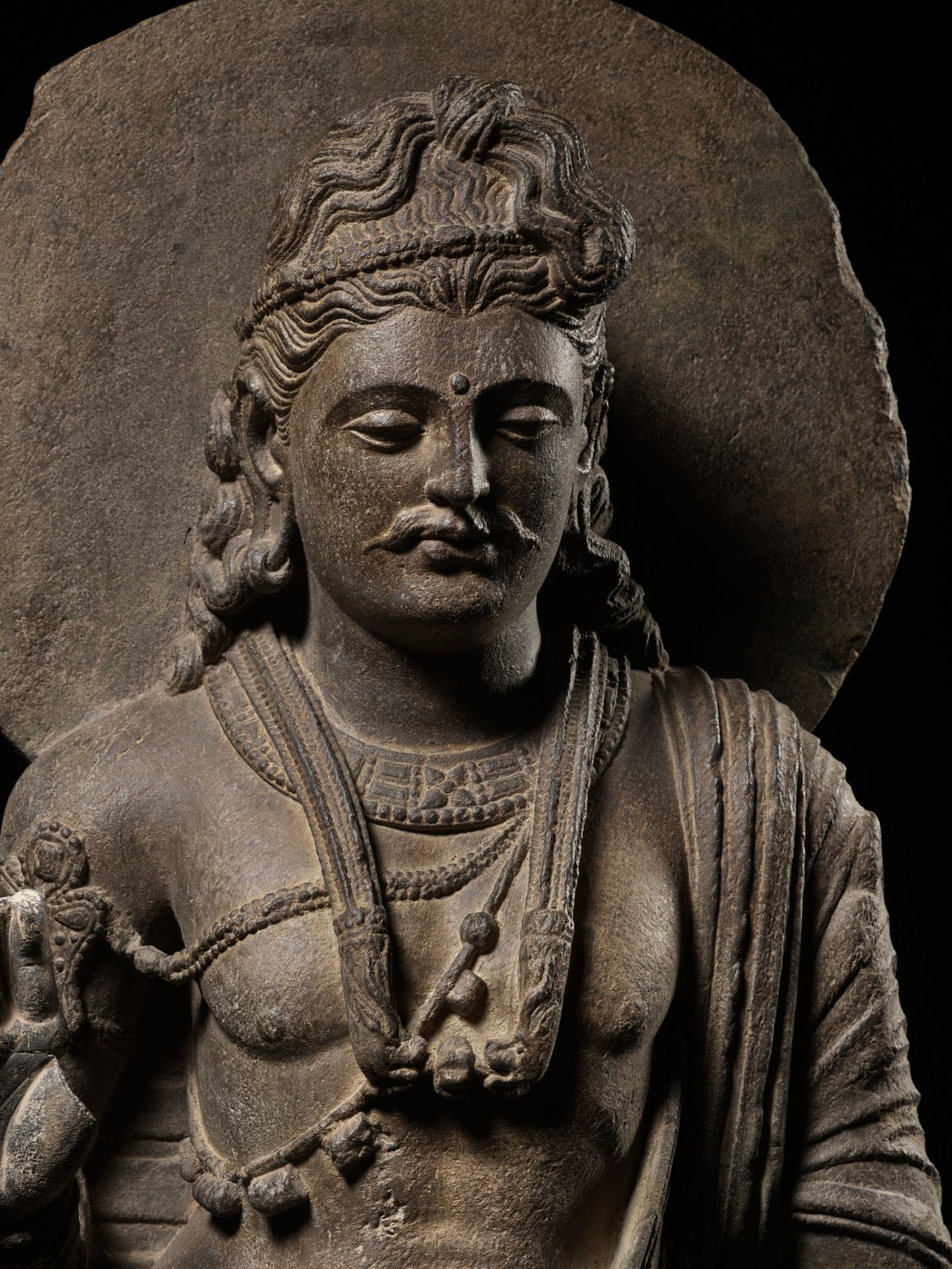 A LARGE AND IMPORTANT GRAY SCHIST FIGURE OF MAITREYA, ANCIENT REGION OF GANDHARA