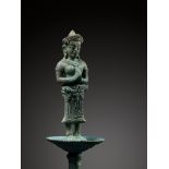 A KHMER BRONZE FITTING WITH A FIGURE OF A FEMALE DEITY, ANGKOR PERIOD