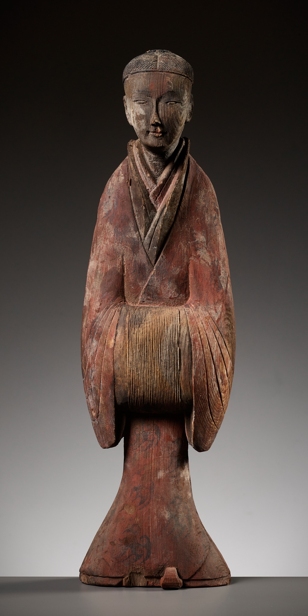 A PAINTED WOOD FIGURE OF A COURT LADY, WARRING STATES PERIOD TO WESTERN HAN DYNASTY