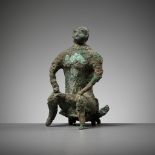 A BRONZE FIGURE OF A SEATED MAN, DONG SON CULTURE