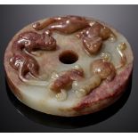 AN ARCHAISTIC CELADON AND RUSSET JADE 'CHILONG' DISC, BI, MING DYNASTY