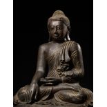 A MONUMENTAL LACQUER-GILT BRONZE STATUE OF BUDDHA SHAKYAMUNI, MANDALAY PERIOD