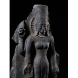 A BLACK STONE FIGURE OF DURGA MAHISHASURAMARDINI, PRE-ANGKOR PERIOD, KHMER, 7TH CENTURY