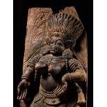 A LARGE AND HIGHLY IMPRESSIVE WOOD RELIEF OF A DANCING FEMALE DEMON, KERALA, SOUTH INDIA, 17TH CT