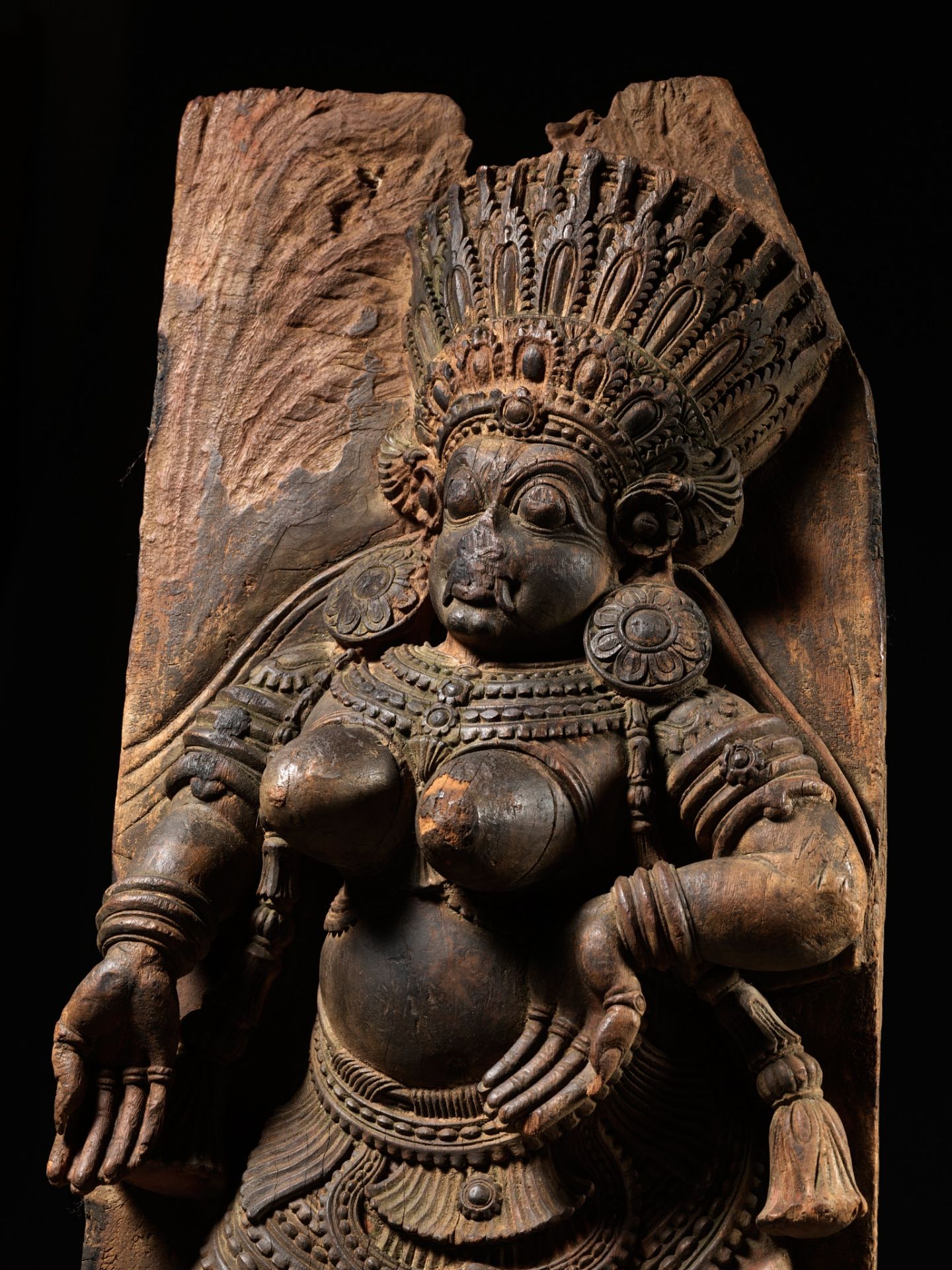 A LARGE AND HIGHLY IMPRESSIVE WOOD RELIEF OF A DANCING FEMALE DEMON, KERALA, SOUTH INDIA, 17TH CT