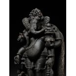 A GRANITE FIGURE OF GANESHA, ORISSA, 13TH CENTURY