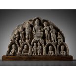A GRAY SCHIST GABLE OF BUDDHA SURROUNDED BY HIS DISCIPLES, KUSHAN PERIOD