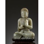 A CELADON JADE FIGURE OF BUDDHA, 17TH-18TH CENTURY