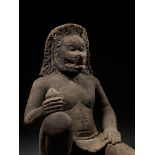 A MONUMENTAL SANDSTONE FIGURE OF NARASIMHA, KHMER EMPIRE, 10TH-12TH CENTURY