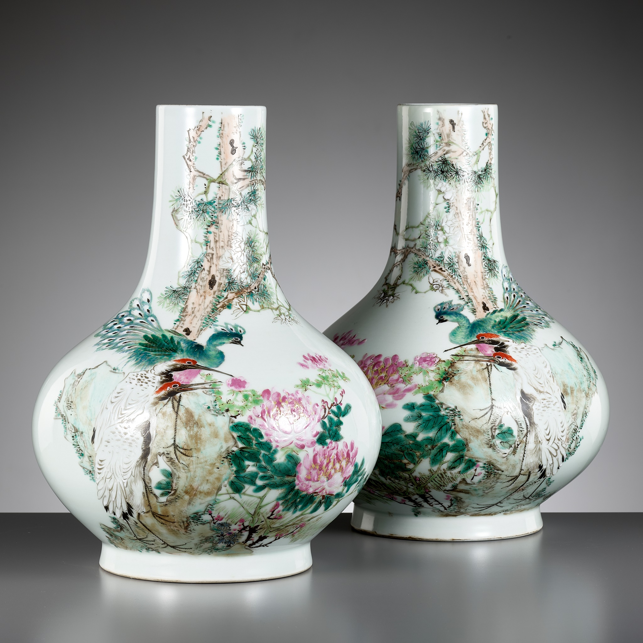 A PAIR OF 'QIANJIANG CAI' ENAMELED 'PEACOCK AND CRANE' VASES, BY MA QINGYUN, DATED 1920