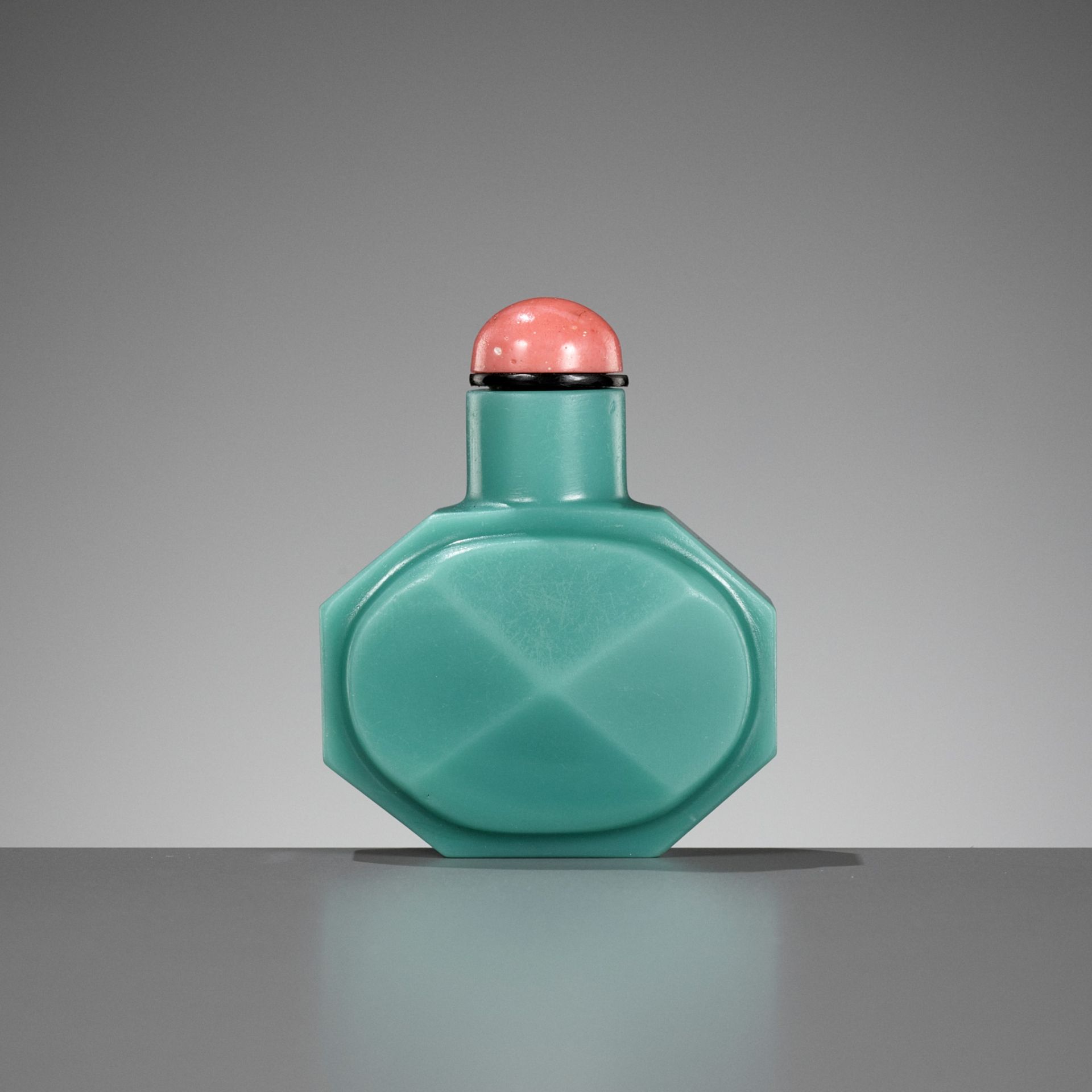 A TURQUOISE GLASS FACETED SNUFF BOTTLE, WHEEL-CUT QIANLONG MARK AND OF THE PERIOD