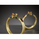 A PAIR OF GOLD 'BIRD' BANGLES, PERSIA, 11TH TO 12TH CENTURY