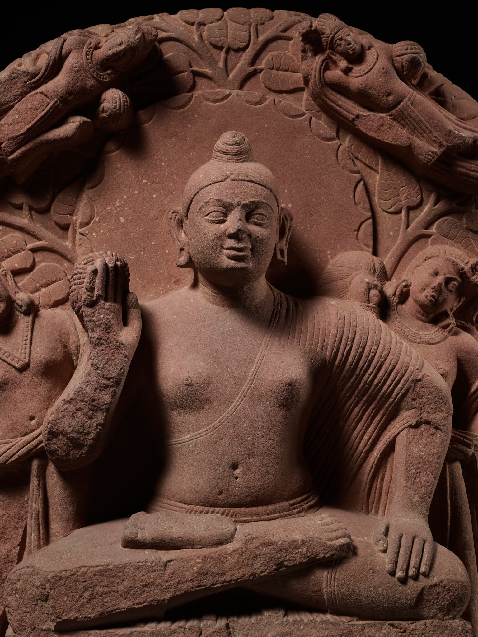 A PINK SANDSTONE STELE DEPICTING BUDDHA, MATHURA, 2ND-3RD CENTURY