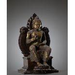 A RARE AND LARGE GILT BRONZE FIGURE OF AN ENTHRONED MAITREYA, CENTRAL JAVANESE PERIOD