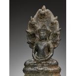 A BRONZE FIGURE OF BUDDHA MUCHALINDA, ANGKOR PERIOD, BAYON STYLE