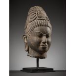 A SANDSTONE HEAD OF AVALOKITESHVARA, PRE-ANGKOR PERIOD