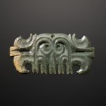 A RARE GREEN JADE TOOTHED ANIMAL MASK ORNAMENT, LATE HONGSHAN CULTURE