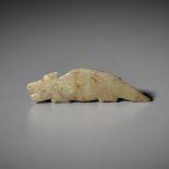 A PALE GREEN JADE 'DRAGON' PENDANT, SHANG TO WESTERN ZHOU DYNASTY