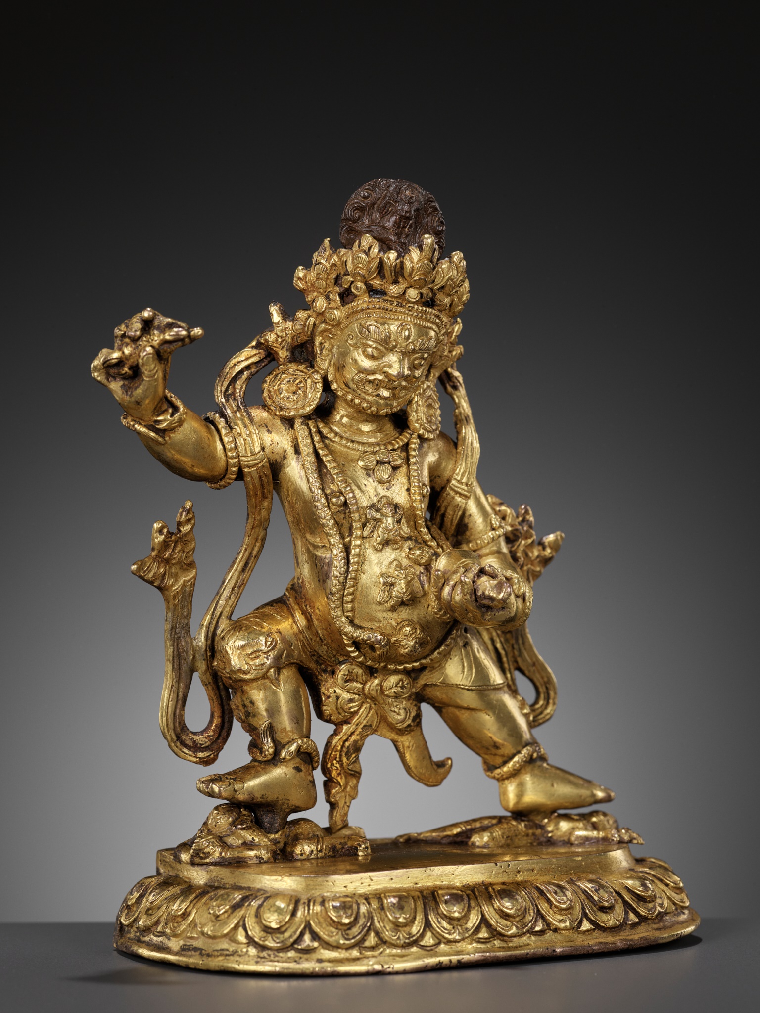 A GILT FIGURE OF VAJRAPANI, TIBET, 17TH-18TH CENTURY