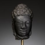 A BLACK STONE HEAD OF BUDDHA, MON-DVARAVATI PERIOD