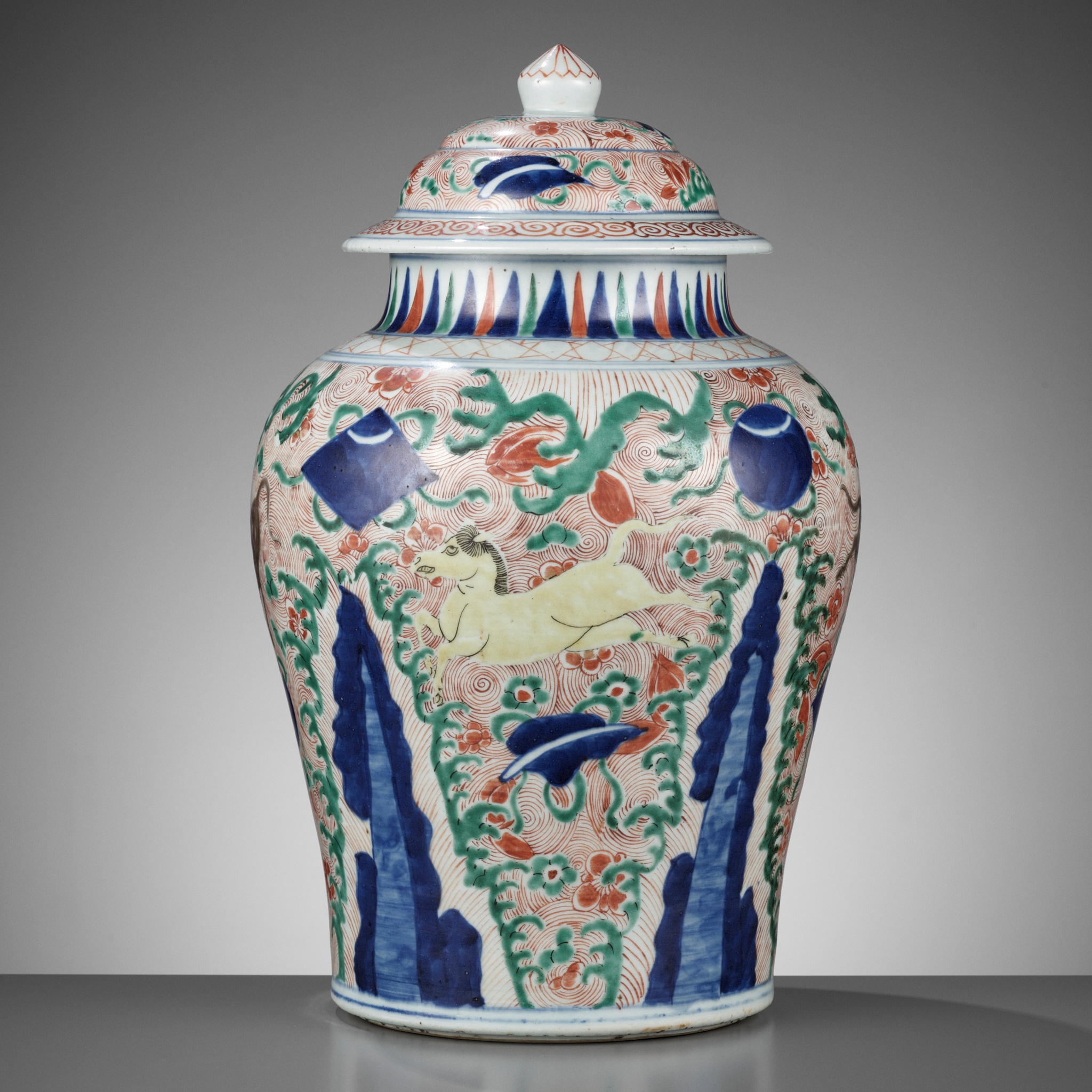 A WUCAI 'GALLOPING HORSES' JAR AND COVER, SHUNZHI PERIOD