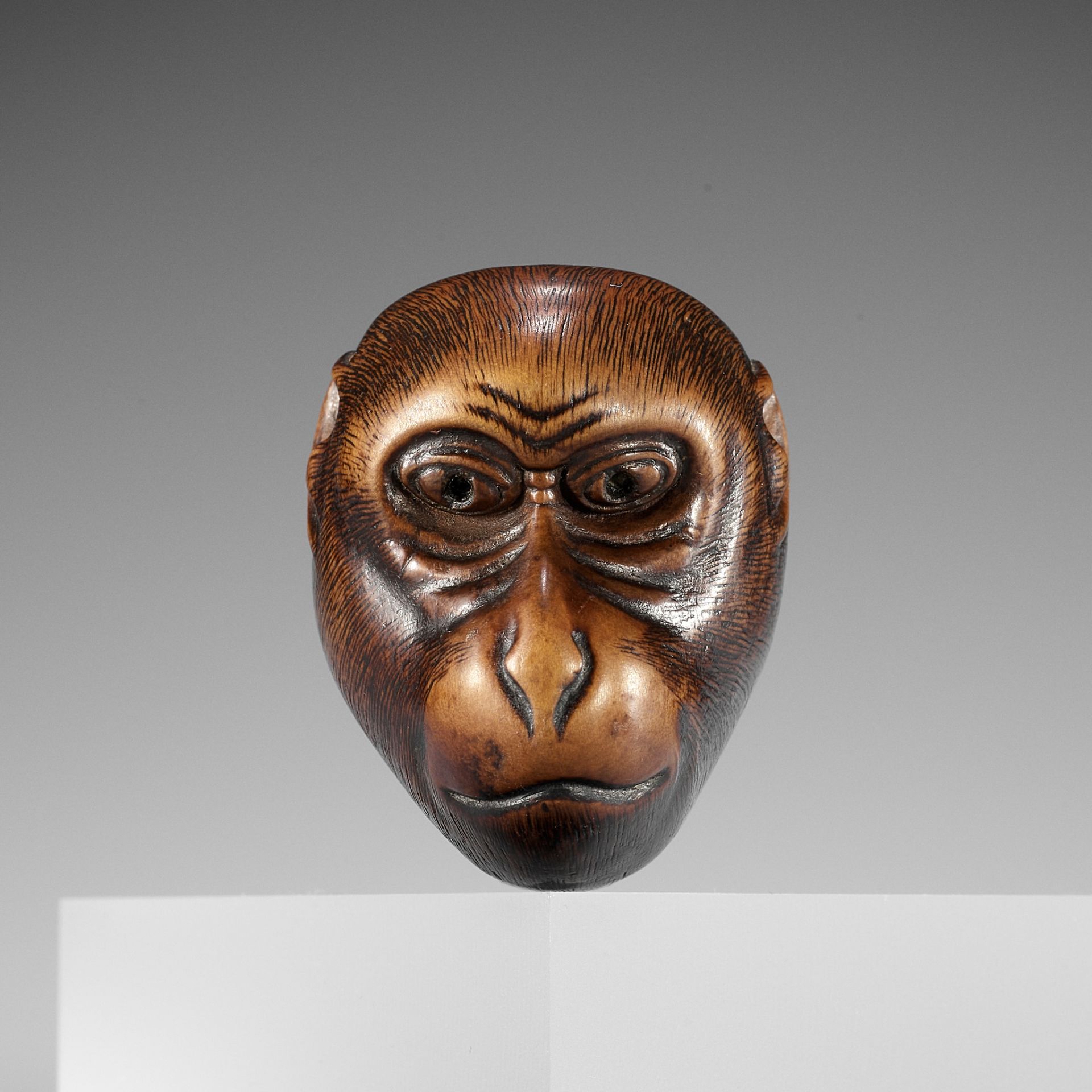 IKKO: A WOOD KYOGEN MASK NETSUKE OF A MONKEY (SARU)